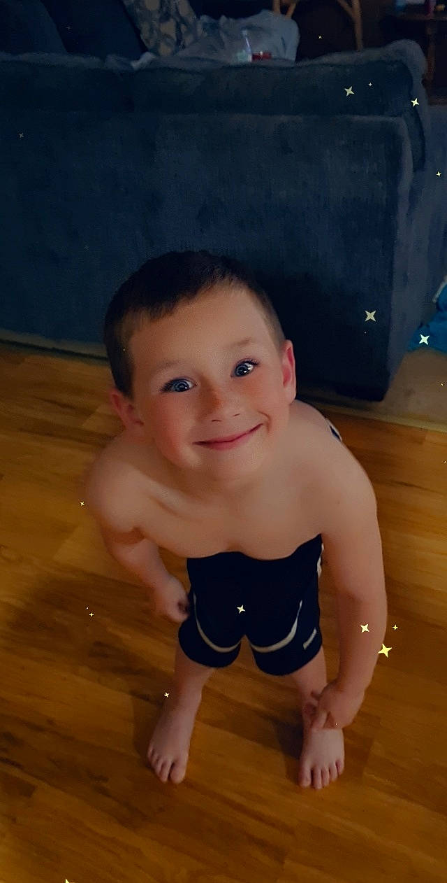Gunner is registered to the contest to win money with this photo: baby_toddler_clothing, cheek, chest, eye, flash_photography, floor, flooring, glasses, happy, head, human_body, iris, joy, leg, mouth, nose, person, skin, smile, stomach