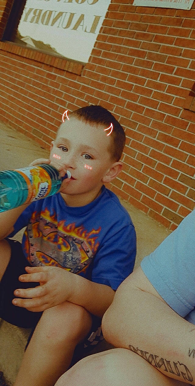 Gunner is registered to the contest to win money with this photo: arm, elbow, electric_blue, eye, flooring, fun, hair, happy, head, human_leg, joint, knee, leisure, mouth, muscle, person, shoulder, sitting, t_shirt, thigh