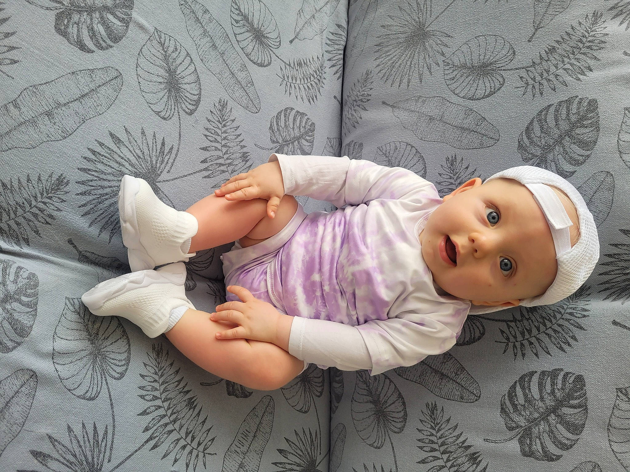 Ayden participe au concours pour gagner de l'argent avec cette photo : baby, baby_products, baby_toddler_clothing, child, comfort, eyelash, finger, foot, gesture, happy, human_leg, linens, pattern, person, room, skin, sleeve, textile, thumb, toddler