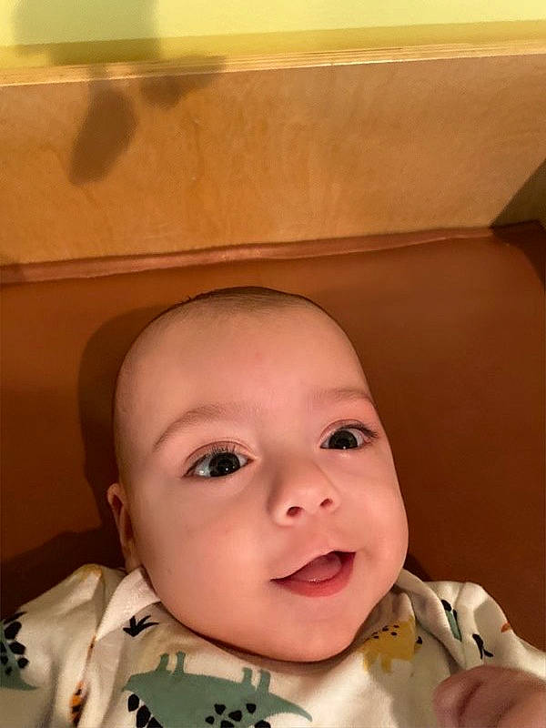 Jett is registered to the contest to win money with this photo: baby, baby_toddler_clothing, cheek, child, collar, eyebrow, eyelash, happy, iris, jaw, lip, mouth, nose, person, sitting, sleeve, smile, toddler, tooth, window