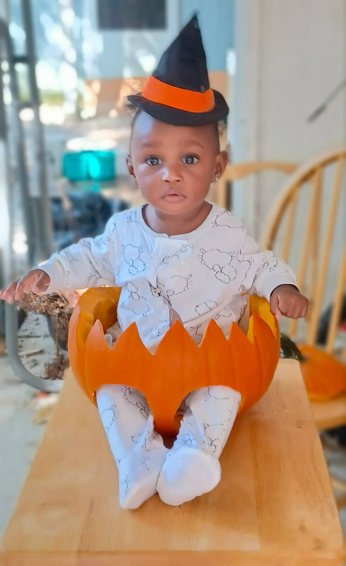 Raelise is registered to the contest to win money with this photo: baby_toddler_clothing, bicycle_wheel, cap, chair, child, costume, costume_hat, fashion_accessory, fashion_design, happy, jewellery, necklace, orange, person, sitting, sleeve, tire, toddler, toy, uniform