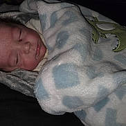 Areis joined the competition — help win amazing prizes! baby, sleeping, blanket, soft, infant, child, cozy, face, peaceful, cute, dinosaur, pattern, blue, white, skin, wrapped, resting, warm, clothing, portrait