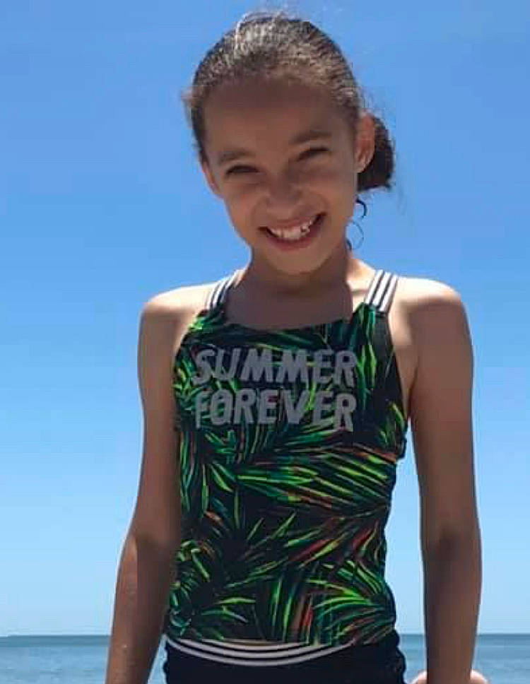 Laylah is registered to the contest to win money with this photo: face, flash_photography, fun, hair, happy, head, joy, leisure, muscle, neck, person, shoulder, sky, sleeve, sleeveless_shirt, smile, sportswear, standing, summer, swimwear