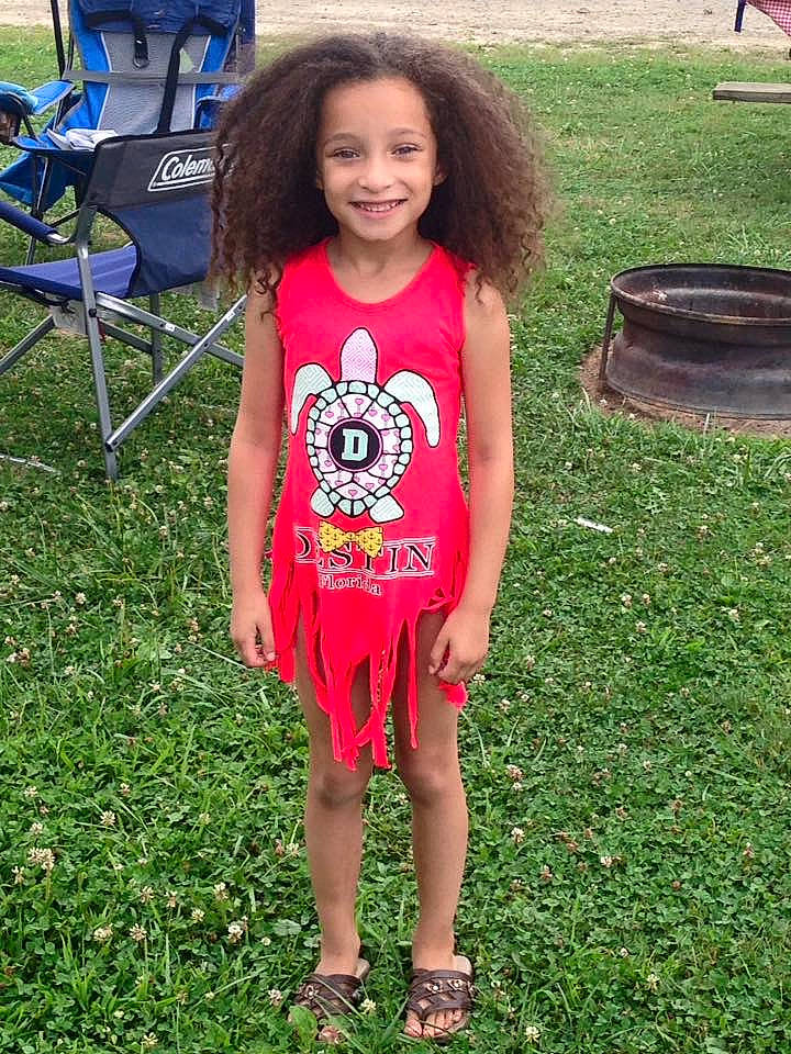 Laylah joined the competition — help win amazing prizes! chair, event, face, fashion_design, fun, grass, happy, human_leg, joy, lawn, leisure, magenta, pattern, people_in_nature, person, recreation, sandal, sleeve, smile, t_shirt