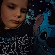 Kayleigh joined the competition — help win amazing prizes! child, face, pillow, blanket, stitch, character, cartoon, blue, bedroom, cozy, clothing, necklace, jewelry, portrait, indoor, young, expression, comfort, sleep, tired