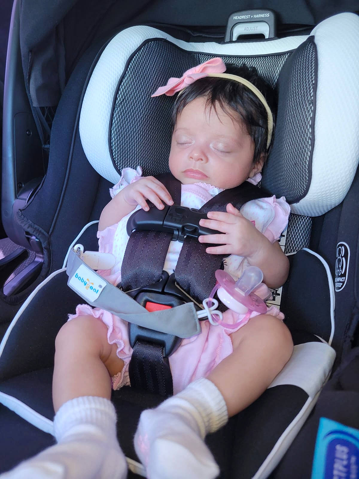 Kaylani is registered to the contest to win money with this photo: arm, auto_part, automotive_design, baby, baby_carriage, baby_in_car_seat, baby_toddler_clothing, car_seat, car_seat_cover, comfort, finger, hand, head_restraint, lap, leg, person, plant, product, seat_belt, thigh