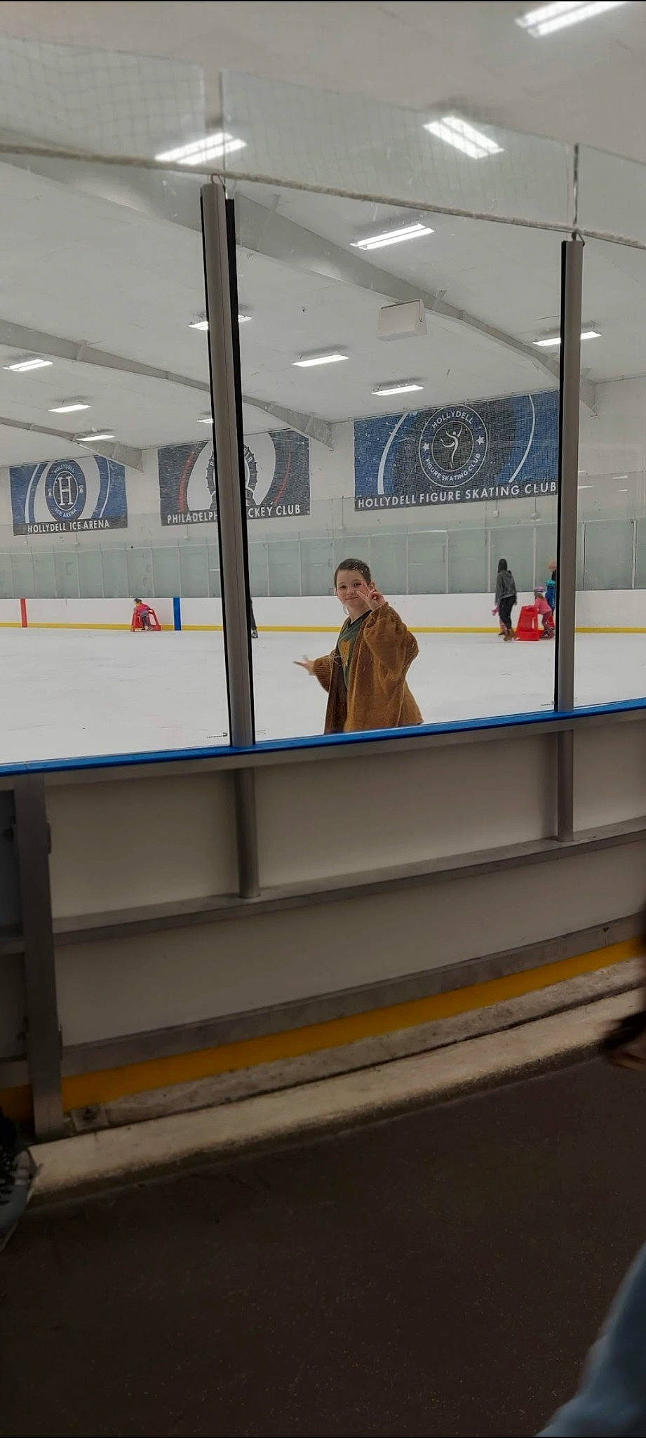 Sienna is registered to the contest to win money with this photo: advertising, automotive_exterior, building, ceiling, daylighting, display_case, floor, flooring, glass, ice_rink, joy, leisure, passenger, person, public_transport, recreation, room, shade, tile, transport