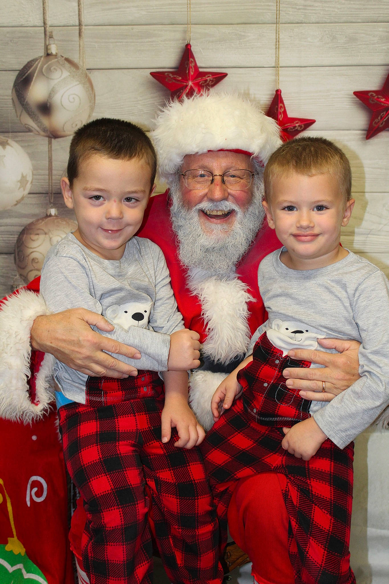 Justis is registered to the contest to win money with this photo: child, christmas, christmas_decoration, event, fictional_character, fun, grandparent, happiness, headwear, holiday, infant, joy, lap, person, product, santa_claus, senior_citizen, skin, smile, standing