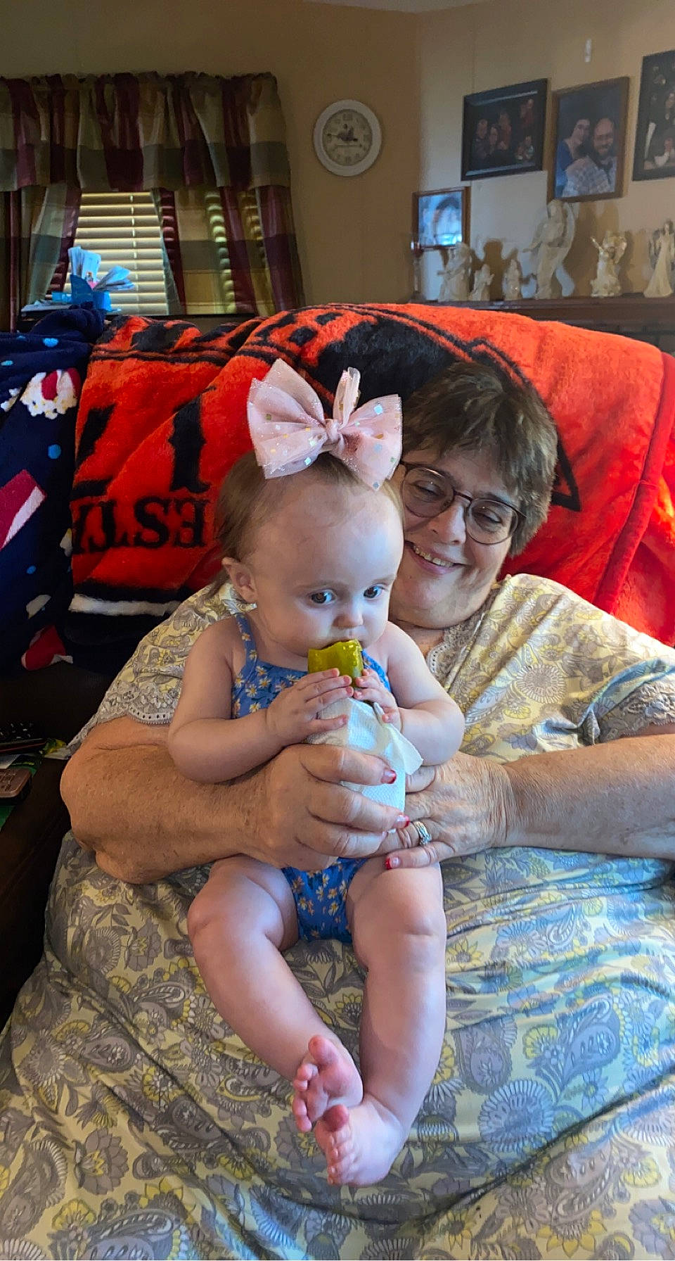 Ivey is registered to the contest to win money with this photo: baby, blurred, child, couch, event, fun, hairstyle, happy, human, interaction, joy, lap, leisure, person, picture_frame, skin, smile, snapshot, summer, textile