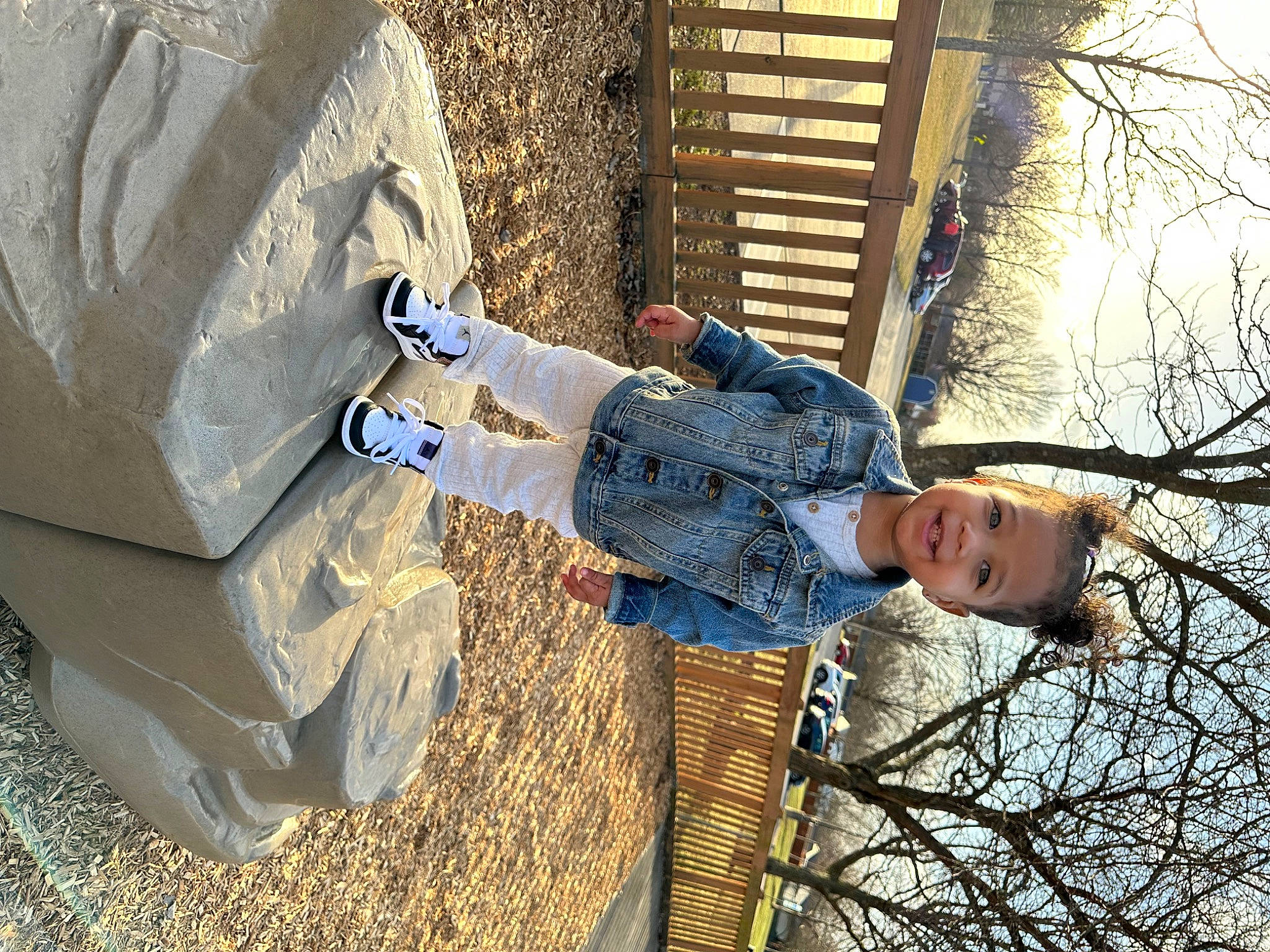 Layla joined the competition — help win amazing prizes! child, concrete, denim, electric_blue, fun, grass, happy, joy, leaf, leisure, people_in_nature, person, personal_protective_equipment, shipping_box, sitting, sky, soil, toddler, tree, twig