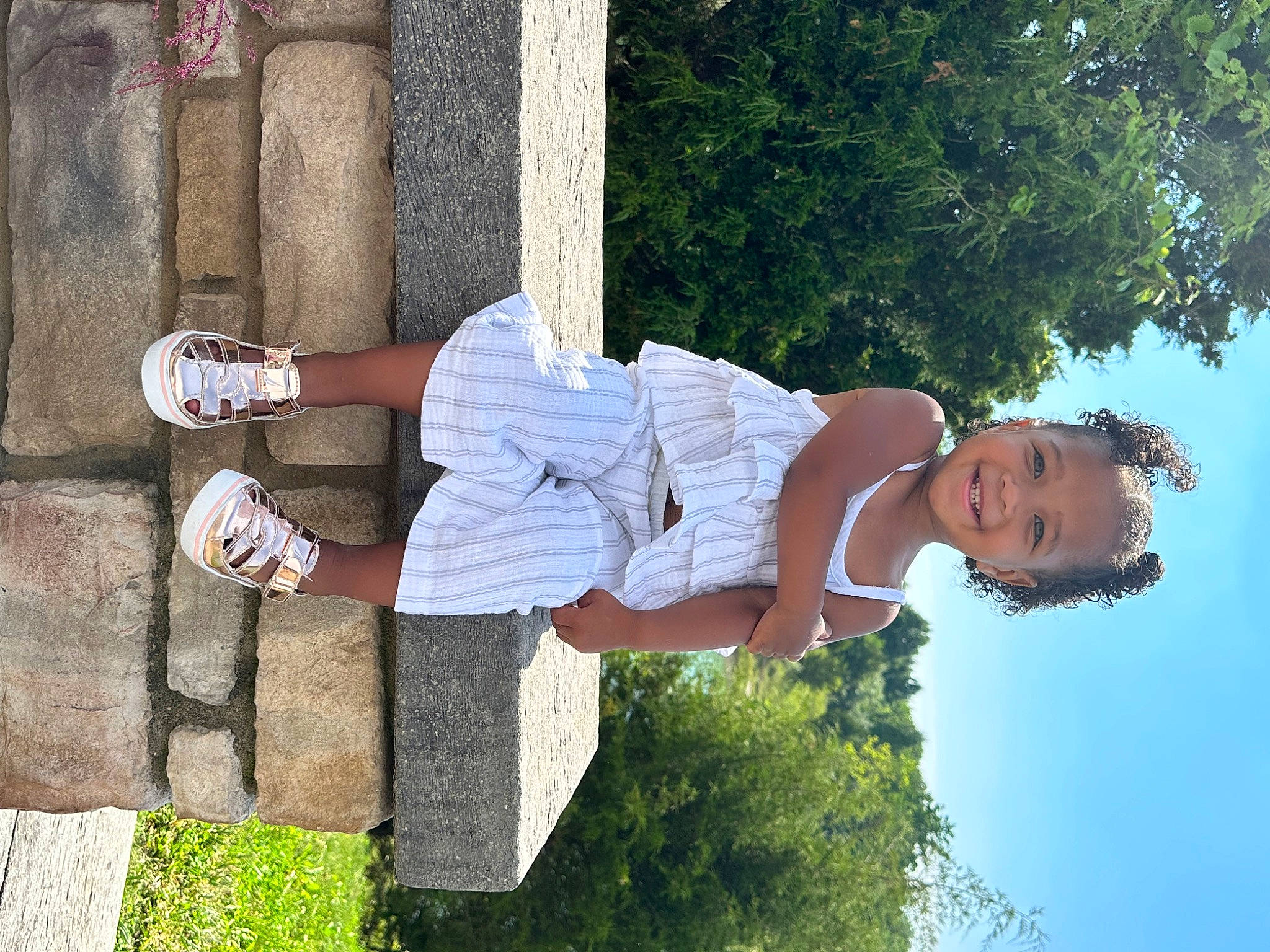 Layla joined the competition — help win amazing prizes! arm, elbow, foot, fun, grass, happy, hat, human_leg, joy, knee, leg, leisure, people_in_nature, person, plant, sky, smile, summer, thigh, tree