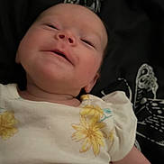 Ellanor joined the competition — help win amazing prizes! baby, blanket, butterfly_pattern, child, closeup, cute, happy, indoors, infant, lying_down, newborn, person, portrait, resting, skin, smiling, soft_light, white_clothing, yellow_flowers, young_child