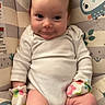 Ellanor joined the competition — help win amazing prizes! baby, baby_seat, cartoon_animals, child, clothing, comfort, cute, expression, happy, indoors, infant, mittens, onesie, playful, portrait, sitting, small_hands, smile, soft_lighting, young_child