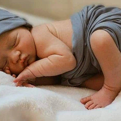 Corbin is registered to the contest to win money with this photo: abdomen, arm, baby_sleeping, chest, comfort, gesture, glasses, head, human_body, human_leg, joint, knee, leg, linens, neck, person, skin, thigh, thumb, toddler