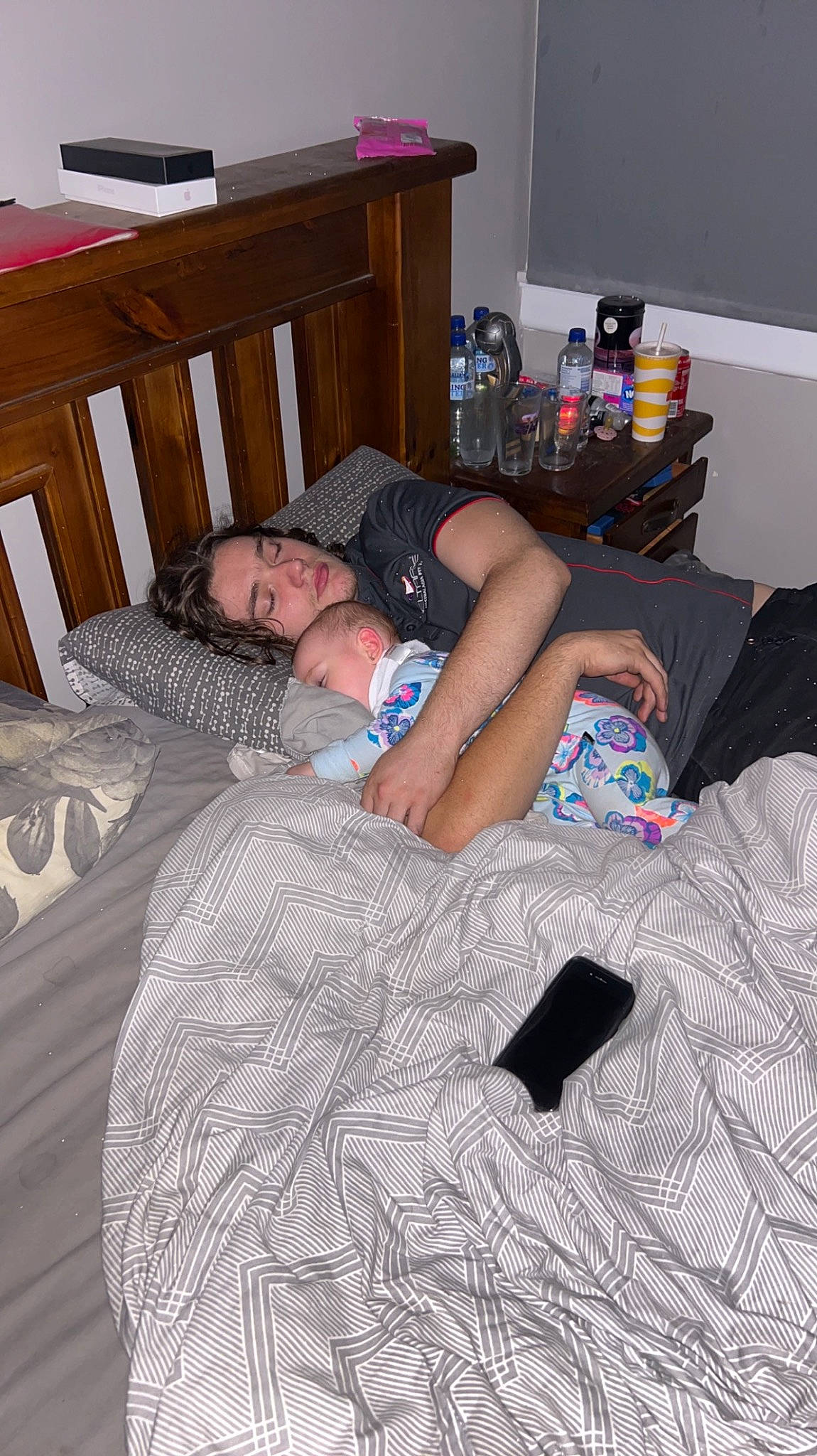 Harleigh is registered to the contest to win money with this photo: bed, bed_sheet, bedding, bedroom, comfort, flooring, fun, furniture, hardwood, human_leg, knee, leg, linens, person, pillow, room, sitting, t_shirt, textile, thigh