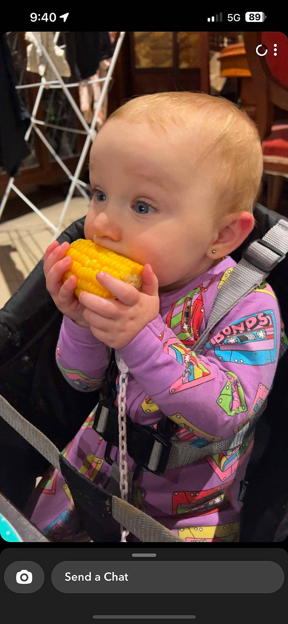 Harleigh joined the competition — help win amazing prizes! baby, biting, chair, child, comfort_food, cuisine, eating, finger, finger_food, fruit, fun, junk_food, local_food, natural_foods, orange, person, play, produce, sweet_corn, toddler