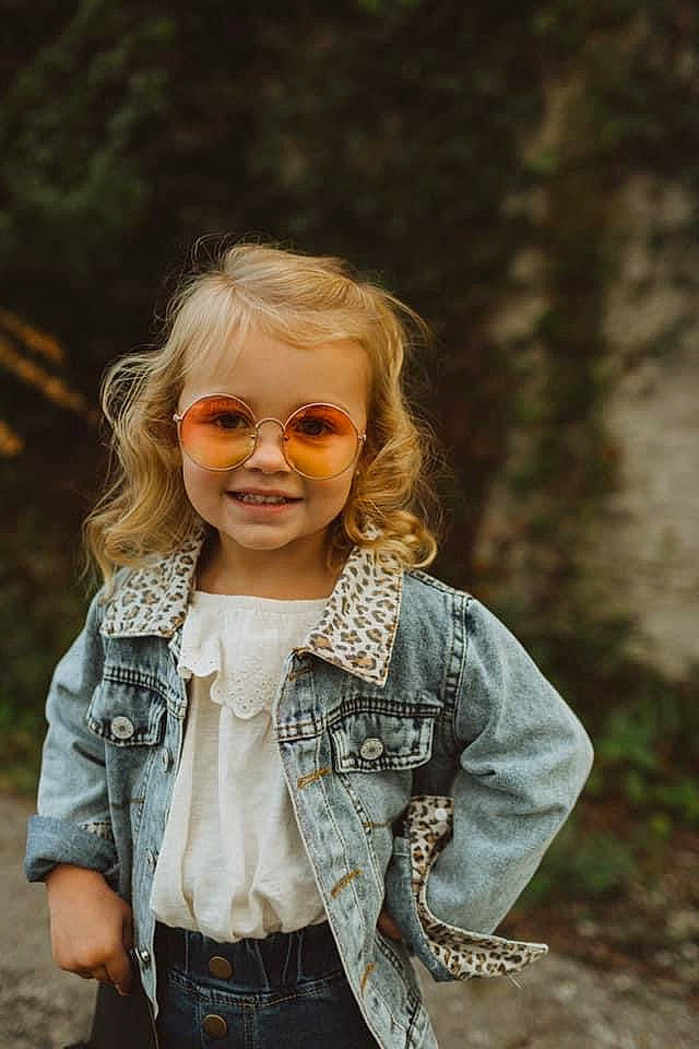 Elaina is registered to the contest to win money with this photo: clothing, face, fawn, flash_photography, grass, hair, happy, head, iris, joy, lip, outerwear, people_in_nature, person, plant, skin, sleeve, smile, standing, street_fashion