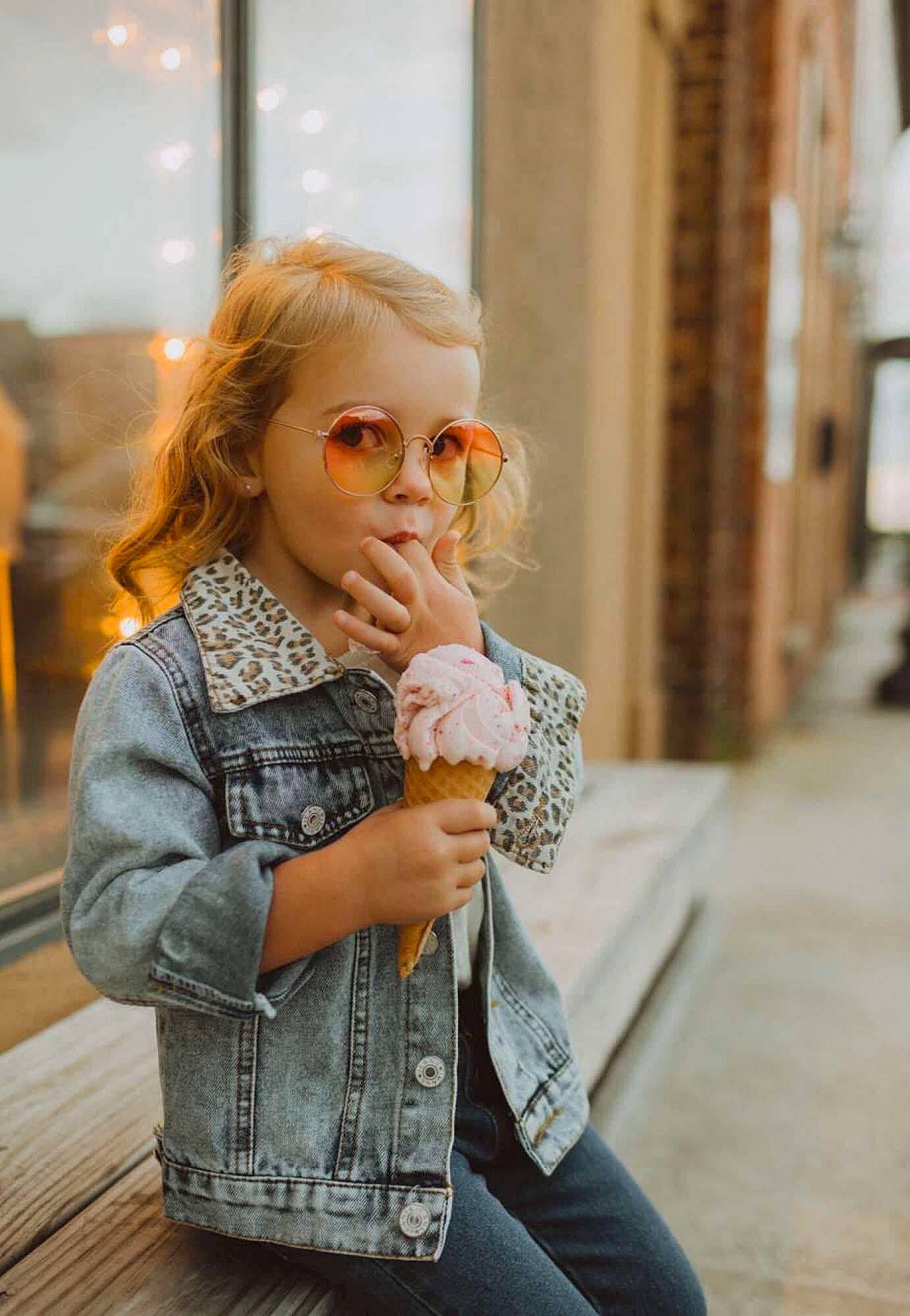 Elaina is registered to the contest to win money with this photo: child, denim, eye, eyewear, fashion, fashion_design, flooring, hairstyle, happy, jacket, lip, long_hair, person, shoulder, sleeve, standing, street_fashion, sunglasses, toddler, vision_care