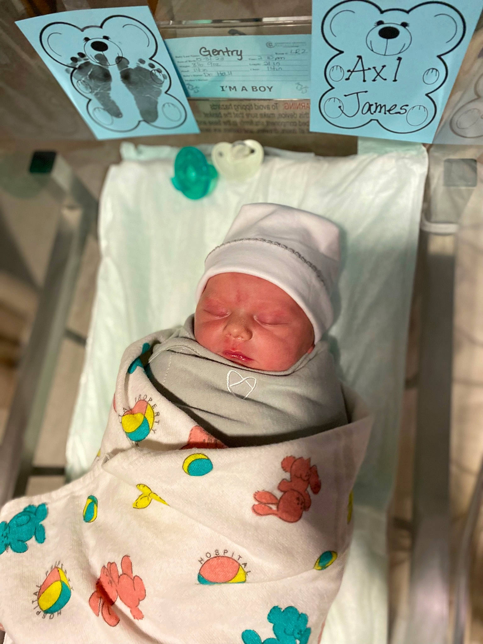 Axl joined the competition — help win amazing prizes! baby, baby_products, baby_safety, baby_sleeping, baby_toddler_clothing, child, comfort, event, headwear, infant_bed, linens, medical, person, room, service, toddler, white