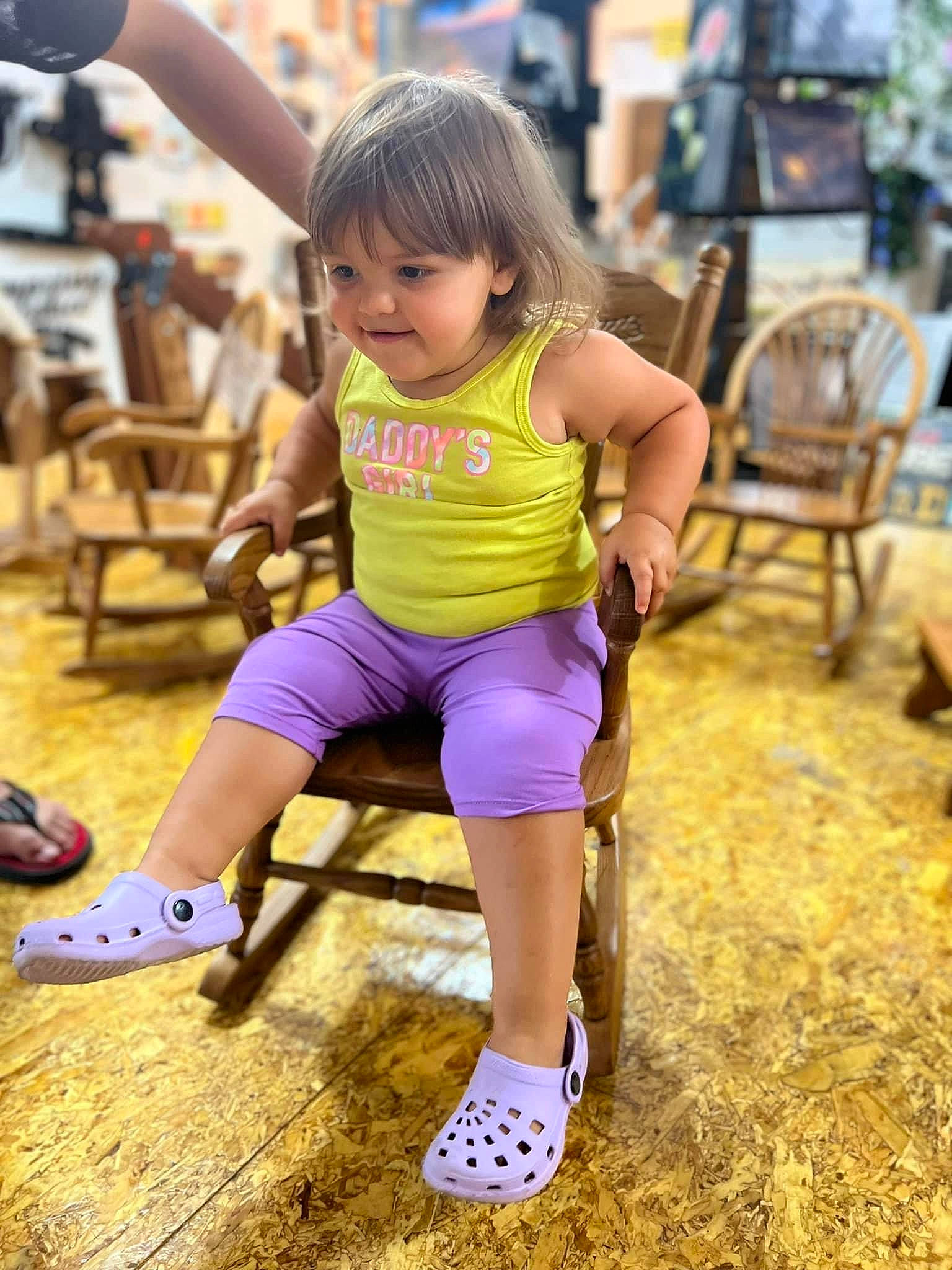 Isabella Rose is registered to the contest to win money with this photo: barefoot, chair, child, electric_blue, event, fun, happy, human_leg, joy, knee, leisure, person, recreation, sandal, shoe, shorts, sneakers, sportswear, t_shirt, thigh