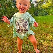 Kohen-Lee joined the competition — help win amazing prizes! toddler, child, barefoot, grass, outdoor, smiling, shirt, duck_graphic, green, nature, forest, sunlight, happy, baby, person, young_child, standing, casual_clothing, daylight, playful