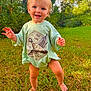 toddler, child, barefoot, grass, outdoor, smiling, shirt, duck_graphic, green, nature, forest, sunlight, happy, baby, person, young_child, standing, casual_clothing, daylight, playful