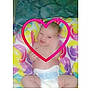 Sheryl is registered to the contest to win money with this photo: baby, infant, diaper, blanket, heart_graphic, smile, lying_down, colorful, patterned_blanket, bedding, portrait, chubby_cheeks, hand, cute, eyes, head, skin, cuteness, closeup, playful