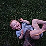 Elizabeth is registered to the contest to win money with this photo: child, baby, toddler, laughing, smiling, grass, clover, lawn, boot, cowboy_boot, adult_leg, striped_onesie, diaper, bare_leg, outdoor, play, candid_photo, joyful, evening_light, portrait