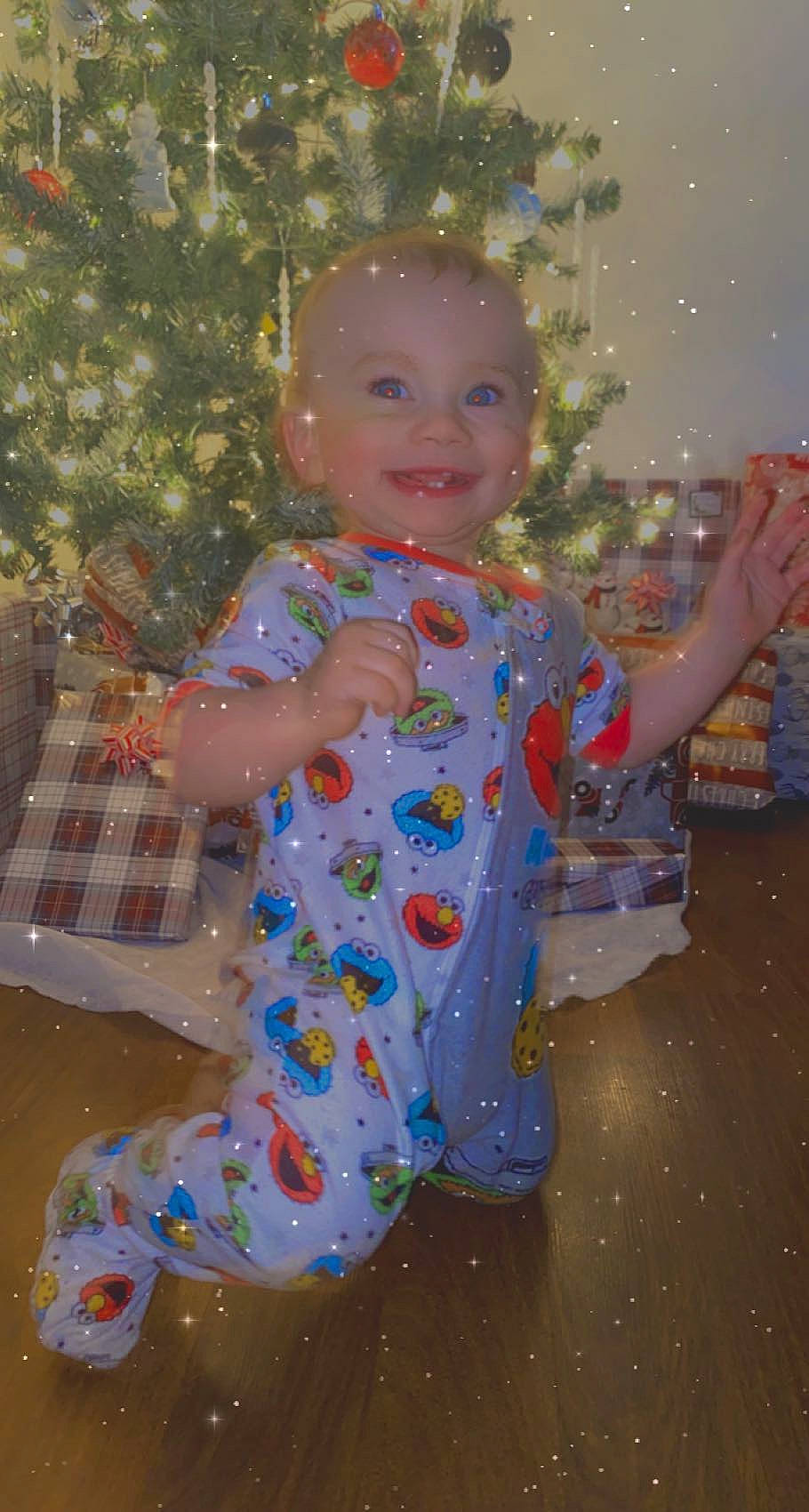 Marcel is registered to the contest to win money with this photo: baby_toddler_clothing, baby_toys, christmas, doll, holiday, joy, ornament, person, plastic, toy