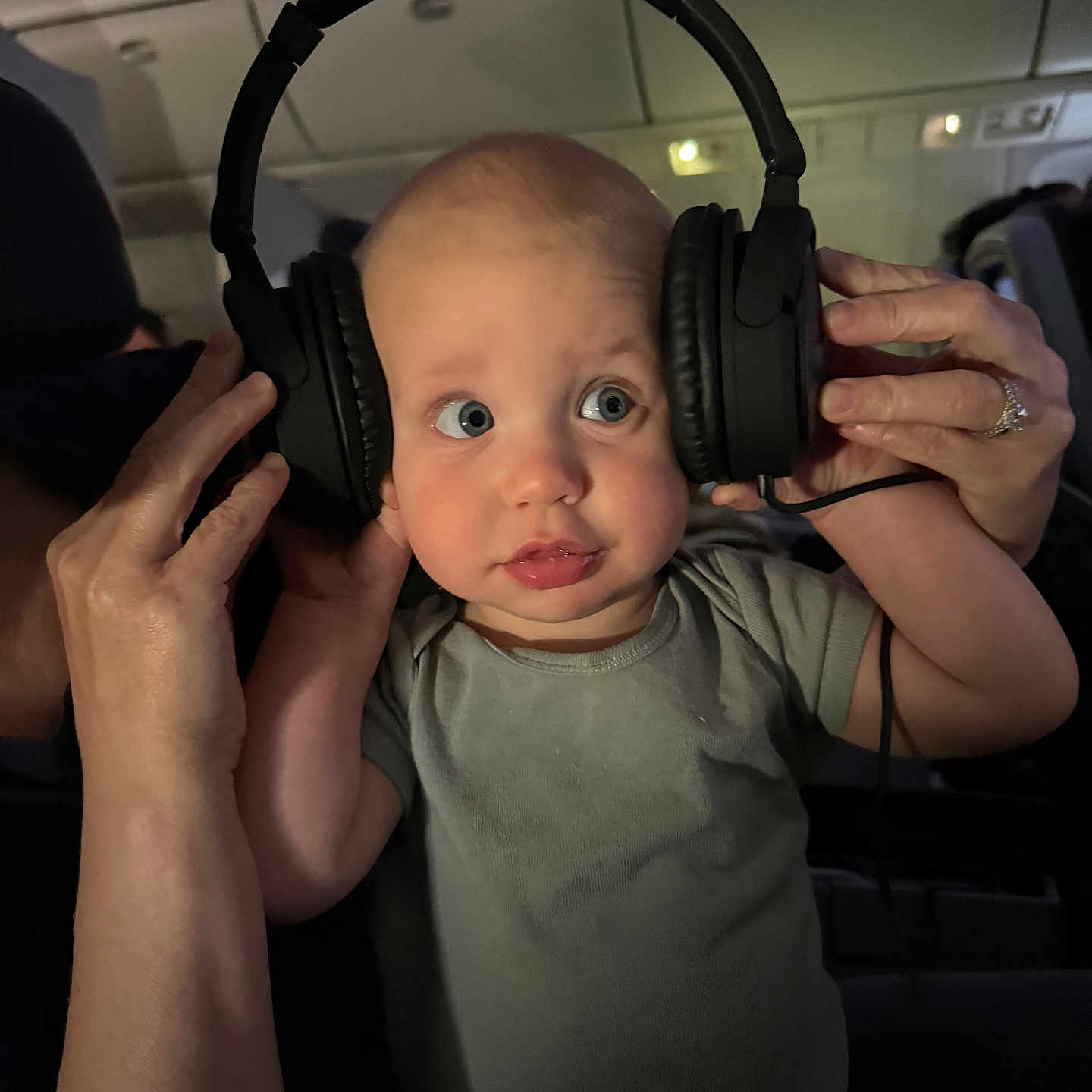 Jack is registered to the contest to win money with this photo: accessories, adult, baby, bodypart, electronics, face, female, finger, hand, happy, head, headphones, jewelry, person, photography, portrait, ring, smile, woman, wrist