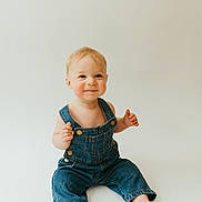 Jack joined the competition — help win amazing prizes! baby, child, denim_overalls, smiling, sitting, barefoot, light_background, cute, happy, portrait, infant, young_child, studio_photo, casual_clothing, one_person, small_child, indoors, face, skin, blond_hair