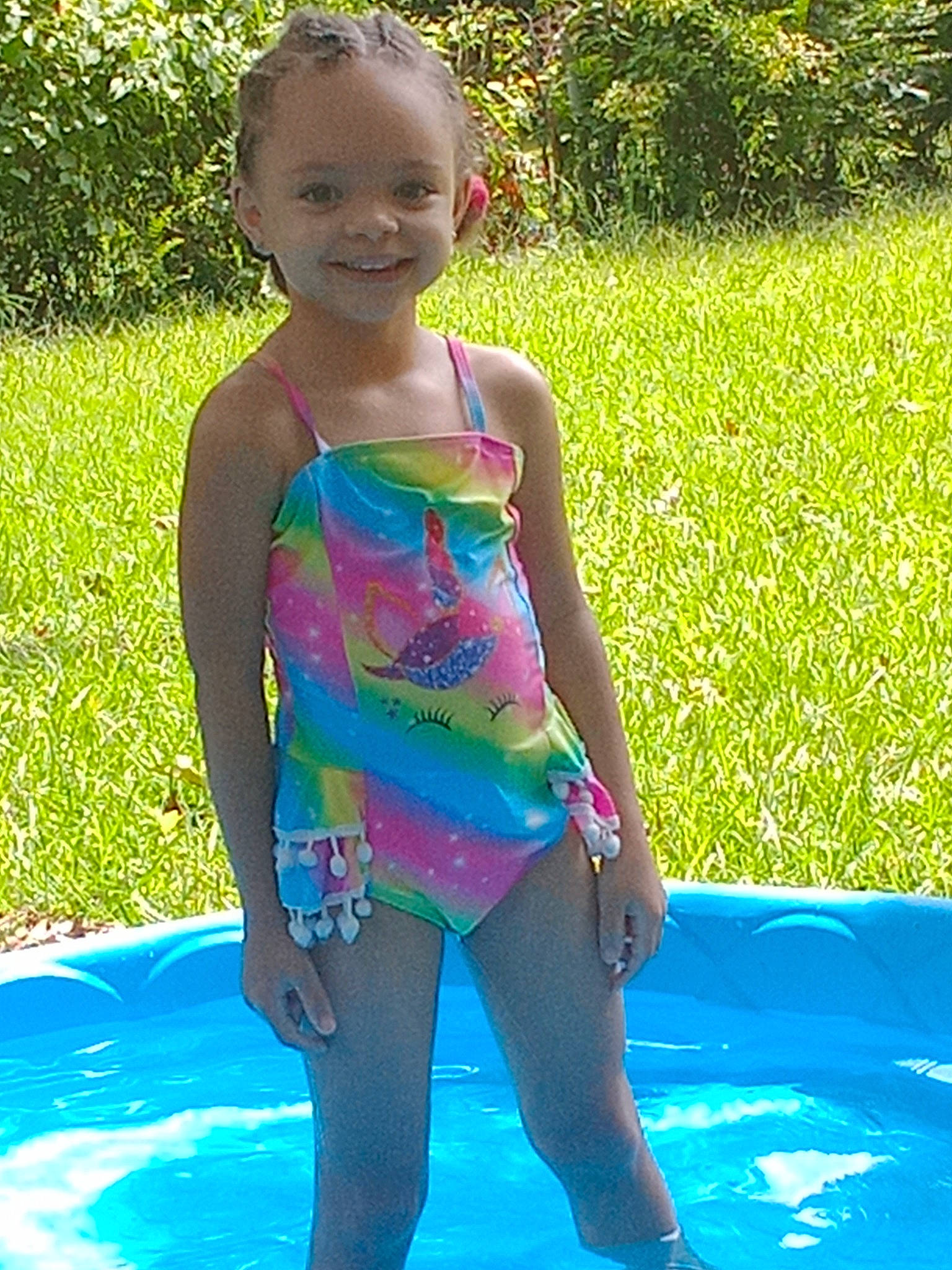 Alexis joined the competition — help win amazing prizes! baby_toddler_clothing, child, electric_blue, facial_expression, fun, grass, green, happy, joy, leisure, people_in_nature, person, plant, recreation, smile, sportswear, summer, sunlight, swimwear, thigh