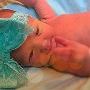 Alaina is registered to the contest to win money with this photo: cheek, child, close_up, finger, hand, head, infant, lip, mouth, skin, toddler