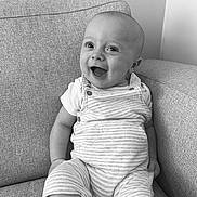 Archie is registered to the contest to win money with this photo: baby, babylaughing, bodypart, chair, clothing, couch, cushion, face, furniture, happy, head, homedecor, laughing, mouth, pants, person, photography, portrait, sitting, smile