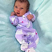 Layla joined the competition — help win amazing prizes! adorable, baby, baby_girl, blanket, child, cozy, cute, face, feet, footed_pajamas, indoor, infant, lying_down, newborn, onesie, pink_bow, portrait, purple_clothing, sleepwear, soft_texture