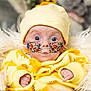 baby, infant, yellow_clothing, hat, nasal_tube, oxygen_tube, medical_tape, fluffy_blanket, blue_eyes, close_up, indoors, cute, newborn, person, face, expression, hospital, healthcare, child, portrait