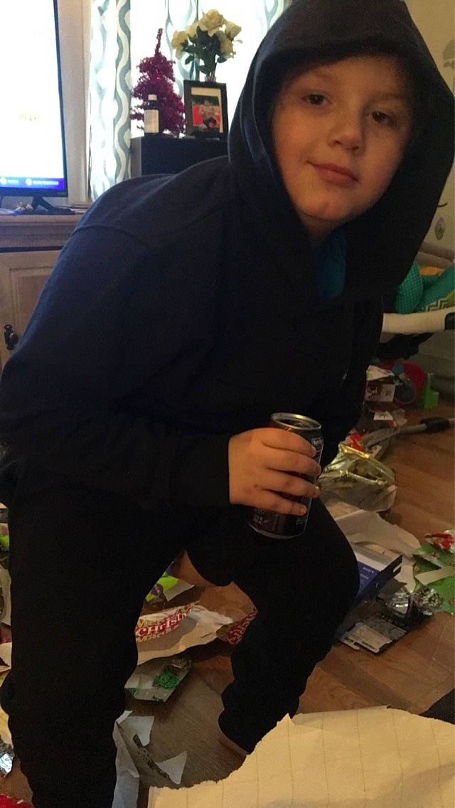 Jose is registered to the contest to win money with this photo: black_hair, child, long_hair, outerwear, person, photography, smile, t_shirt