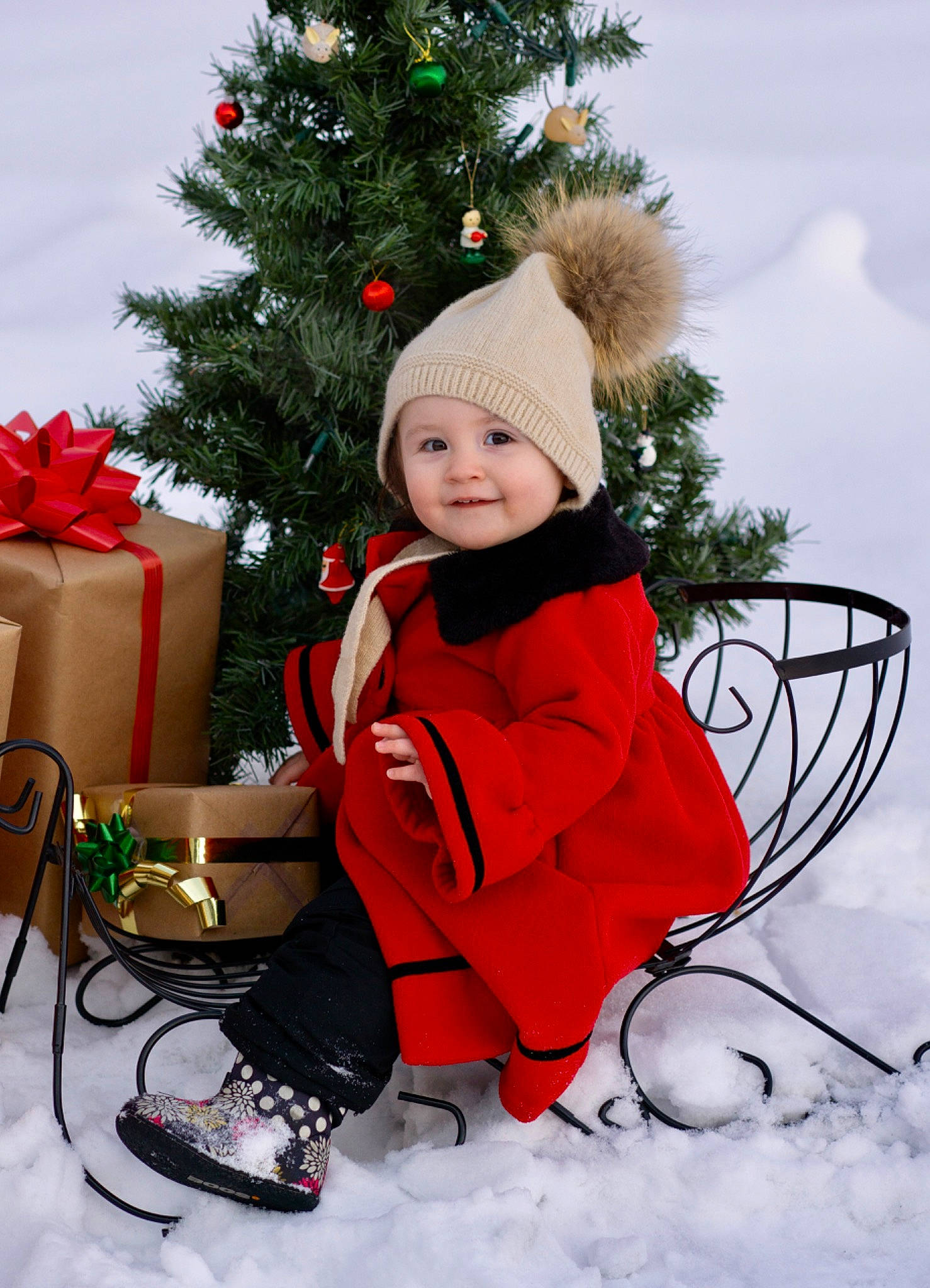 Emmerson joined the competition — help win amazing prizes! baby_toddler_clothing, christmas, christmas_decoration, christmas_ornament, christmas_tree, costume_hat, event, happy, headwear, holiday, holiday_ornament, joy, ornament, people_in_nature, person, plant, shoe, sitting, smile, snow