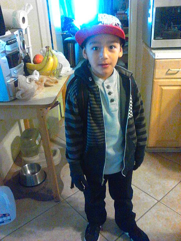 Angel is registered to the contest to win money with this photo: blue, cap, child, electric_blue, fashion_accessory, fashion_design, formal_wear, fur, hat, headgear, headwear, home_appliance, kitchen_appliance, outerwear, person, personal_protective_equipment, room, selfie, sleeve, television