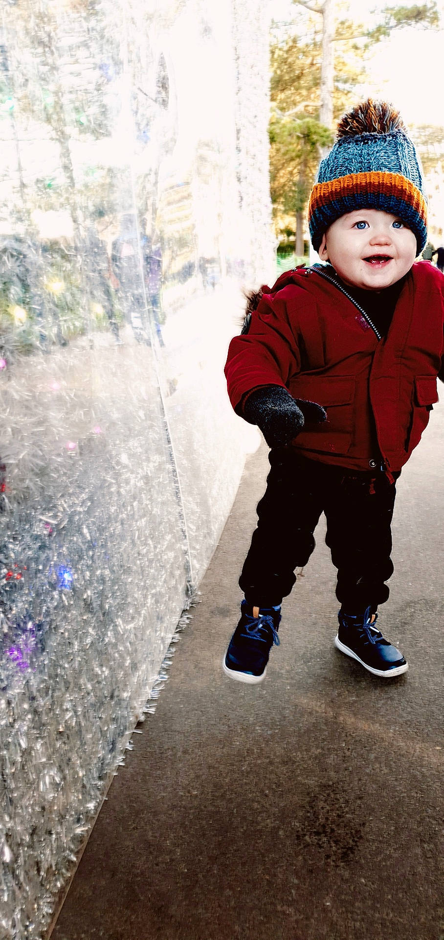 Ryver is registered to the contest to win money with this photo: beanie, bonnet, cap, cheek, child, cool, footwear, freezing, fun, headgear, knit_cap, outerwear, people, person, photography, play, smile, snow, standing, toddler