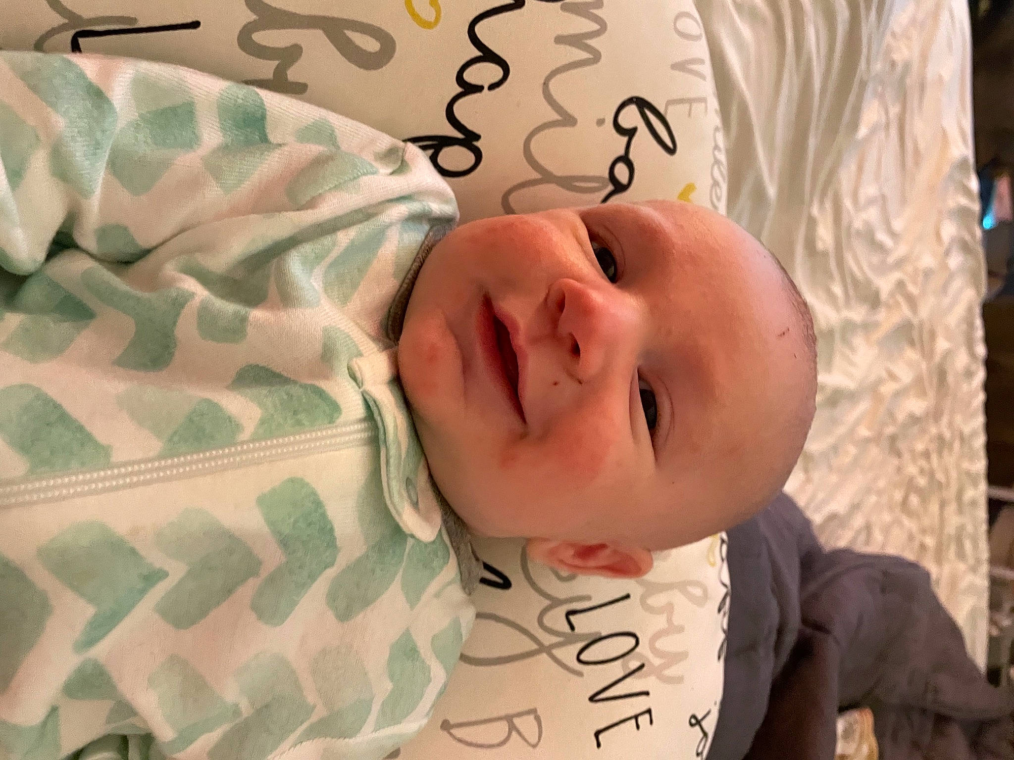 Milo joined the competition — help win amazing prizes! baby, baby_products, baby_safety, baby_toddler_clothing, bedtime, cheek, child, comfort, eyelash, happy, linens, mouth, nose, pattern, person, room, skin, sleeve, smile, textile