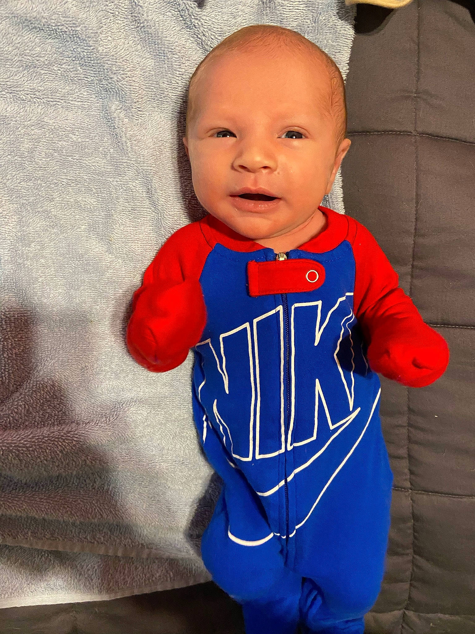 Milo joined the competition — help win amazing prizes! baby, baby_products, baby_toddler_clothing, cheek, child, clothing, electric_blue, eye, gesture, happy, jersey, neck, outerwear, pattern, person, sleeve, smile, sportswear, standing, t_shirt