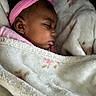 Honesty is registered to the contest to win money with this photo: baby, sleeping, infant, portrait, pink_headband, blanket, wrapped, cozy, peaceful, face, closed_eyes, indoors, bed, bedding, soft, resting, newborn, child, candid, photography