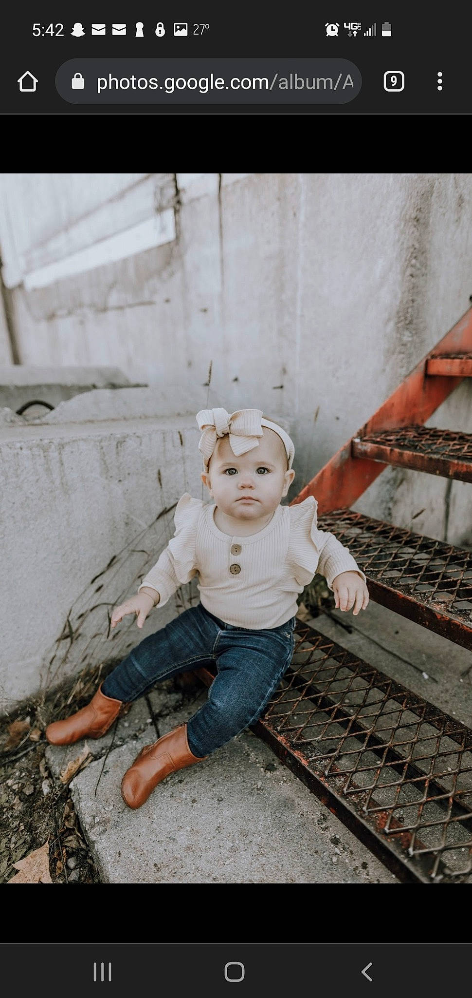 Kimber is registered to the contest to win money with this photo: child, cobblestone, eye, flash_photography, flooring, fun, grass, happy, head, jeans, leg, metal, monochrome, person, personal_protective_equipment, portrait_photography, sitting, symmetry, toddler, track