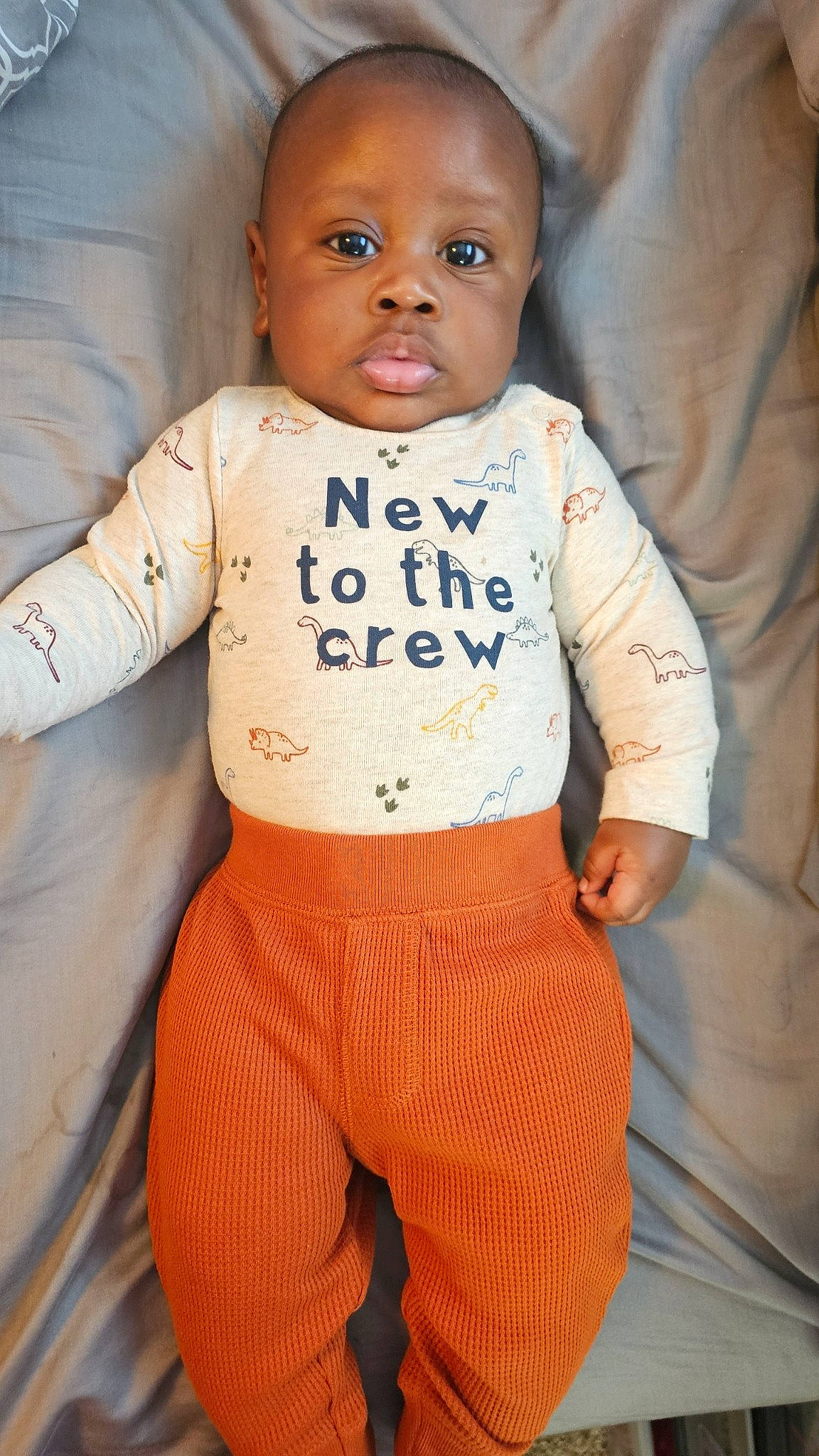 Roman joined the competition — help win amazing prizes! abdomen, arm, baby, baby_products, baby_toddler_clothing, cheek, chest, child, facial_expression, flooring, fun, gesture, happy, nose, orange, pattern, person, sleeve, sportswear, t_shirt