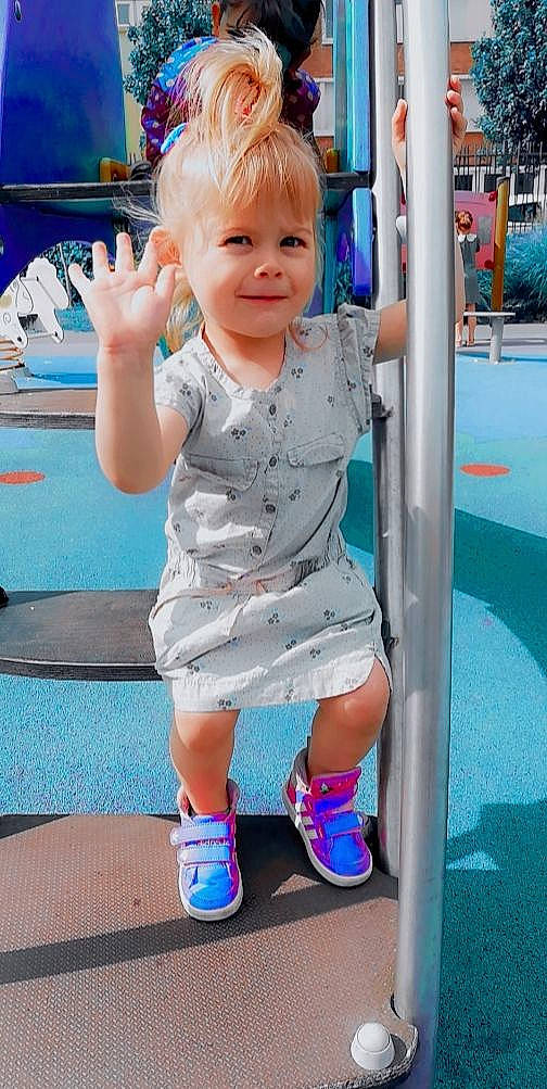 Rose participe au concours pour gagner de l'argent avec cette photo : azure, baby_toddler_clothing, blue, dress, face, hair, hairstyle, hand, happy, joint, joy, person, photograph, pink, product, shoe, skin, sleeve, smile, standing