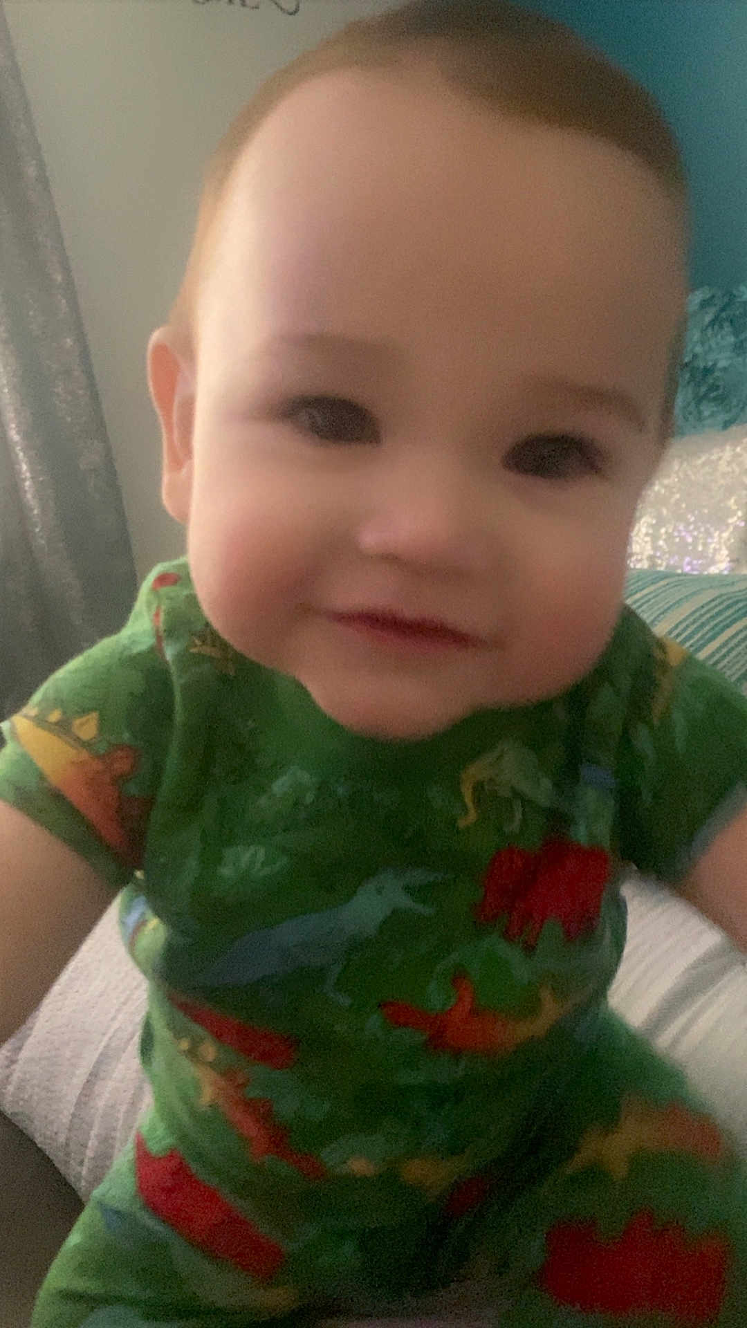 Zyro Duran is registered to the contest to win money with this photo: baby, bodypart, clothing, cushion, dress, face, happy, head, homedecor, indoors, mouth, pajamas, person, photography, portrait, selfie, shirt, smile, t_shirt, teeth