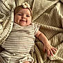 Novella joined the competition — help win amazing prizes! baby, infant, smiling, face, headband, flower, knit_blanket, striped_clothing, cozy, soft_texture, cute, child, portrait, baby_hand, relaxed, indoor, warm_colors, happy, lying_down, comfort