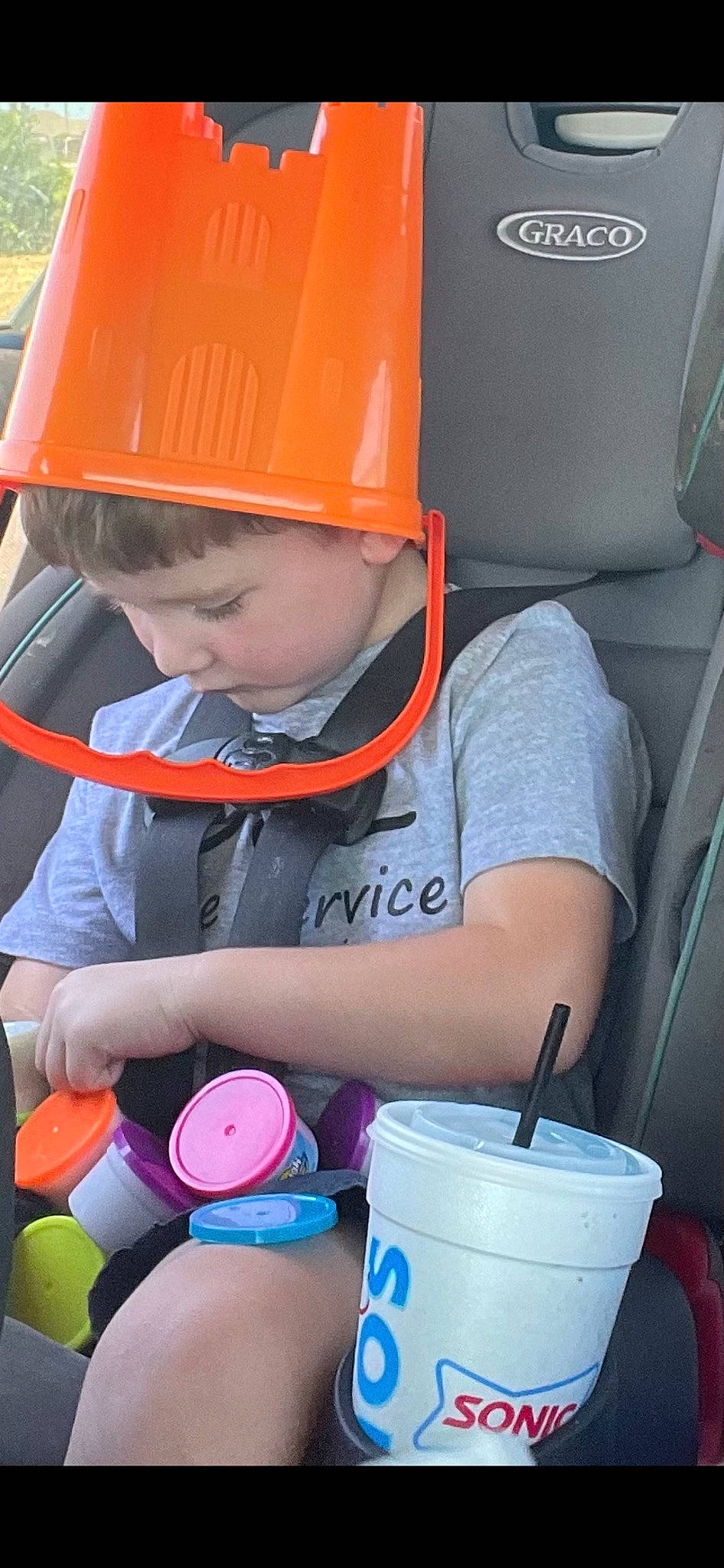 Leighton is registered to the contest to win money with this photo: baby, blue, bucket, child, drinkware, electric_blue, engineering, fashion_accessory, fun, gas, hard_hat, headwear, helmet, leisure, person, personal_protective_equipment, plastic, play, recreation, toddler