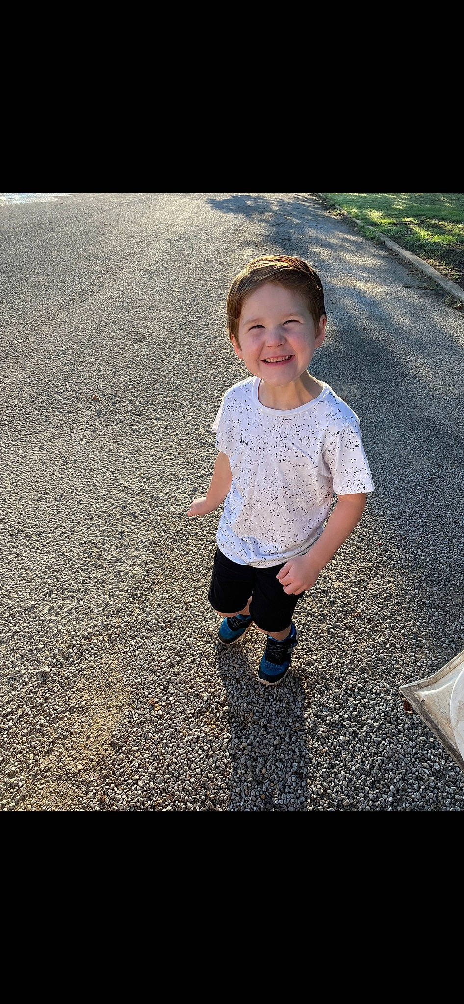 Leighton is registered to the contest to win money with this photo: asphalt, cool, eye, flash_photography, fun, grass, happy, human_body, joy, leg, leisure, pattern, people_in_nature, person, recreation, road, road_surface, smile, standing, tints_and_shades